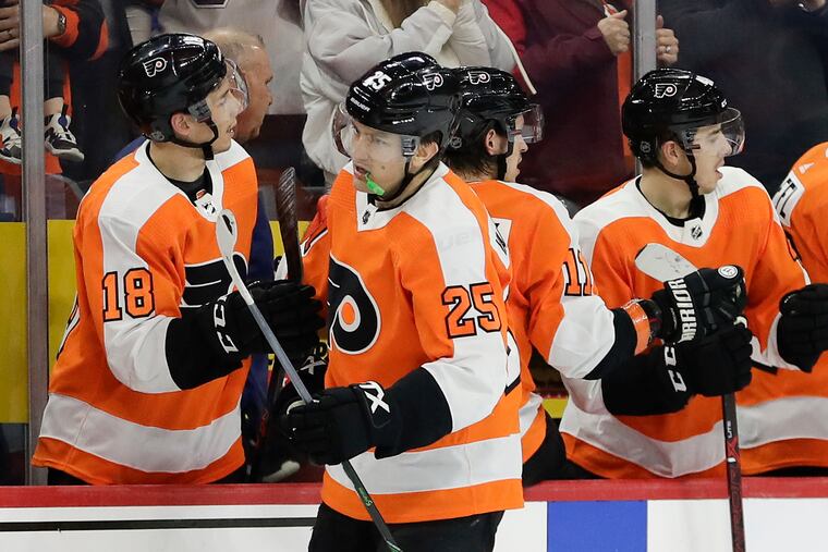 Flyers left winger James van Riemsdyk celebrates his second-period goal with his teammates against Florida on Feb. 10. Van Riemsdyk, the Flyers' player representative, said NHL players have concerns about being isolated from their families for a long time when/if the season resumes.