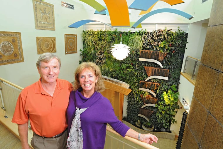 Dansko's founders and owners, Peter Kjellerup and wife Mandy Cabot, in the atrium of the company's headquarters.
