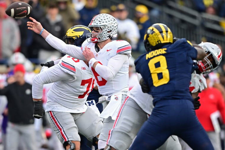 Ohio State quarterback Kyle McCord, a former St. Joseph's Prep star, throws a pass during the second half against Michigan.