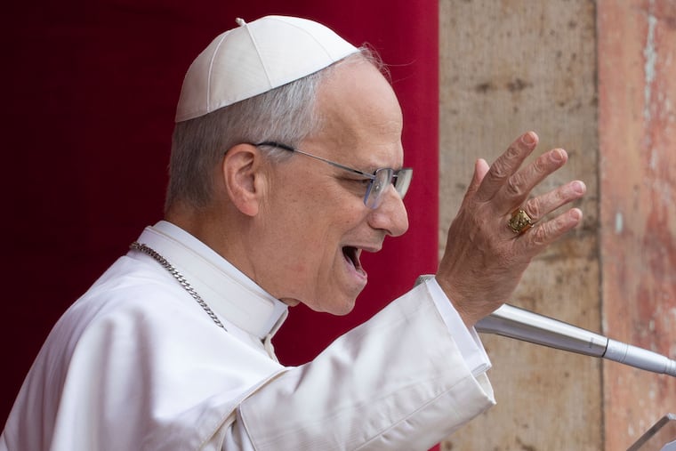FILE - Pope Leo XIV speaks from the central balcony of St. Peter's Basilica from where he delivered his first Sunday blessing since his election to the faithful gathered in St. Peter's Square for the traditional Regina Caeli prayer at noon, on Sunday, May 11, 2025. (AP Photo/Domenico Stinellis, File)
