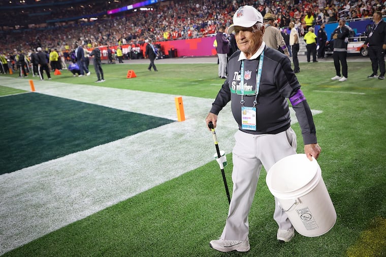 George Toma, 94, who has been the groundskeeper for 57 Super Bowls, walks the field during Super Bowl LVII at State Farm Stadium on Feb. 12 in Glendale, AZ.