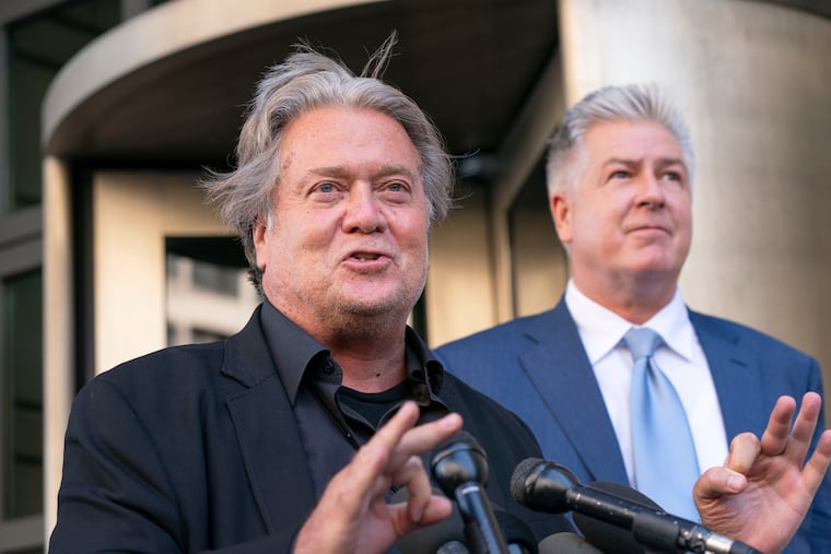 Former White House strategist Steve Bannon accompanied by his attorney M. Evan Corcoran, speaks to the media as he departs federal court in Washington, Wednesday, July 20, 2022. Bannon was brought to trial on a pair of federal charges for criminal contempt of Congress after refusing to cooperate with the House committee investigating the U.S. Capitol insurrection on Jan. 6, 2021.