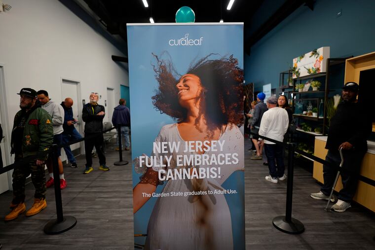 Customers line up inside a Curaleaf dispensary in Bellmawr, N.J. Recreational sales of cannabis for adults 21 and older in the Garden State started in 2022.