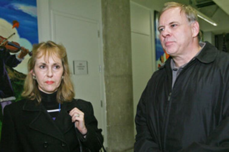 Teacher Linda Casillo & husband Robert Casillo, a school psychologist, at district offices yesterday in search of paychecks.