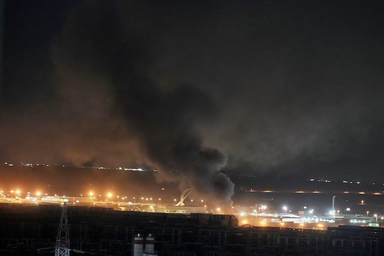 Smoke rises after an explosion at the airport in Irbil, Iraq, late Wednesday, March 11, 2026.