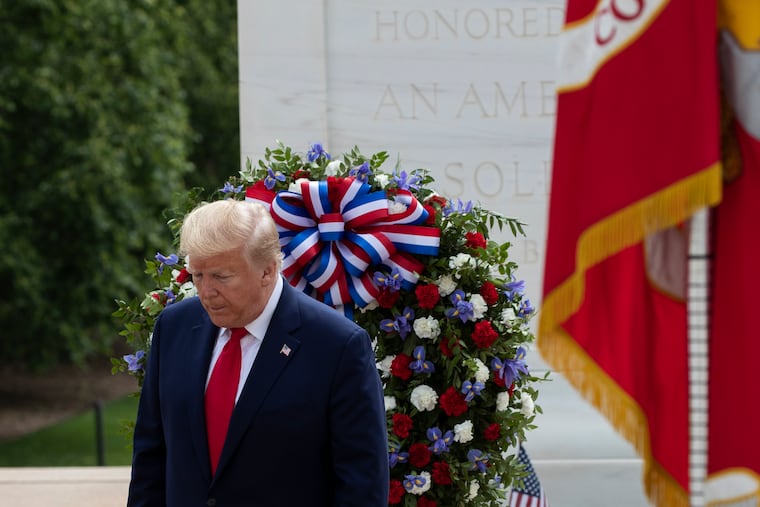 President Donald Trump turns after placing a wreath at the Tomb of the Unknown Soldier in Arlington National Cemetery, in honor of Memorial Day, Monday, May 25, 2020, in Arlington, Va.