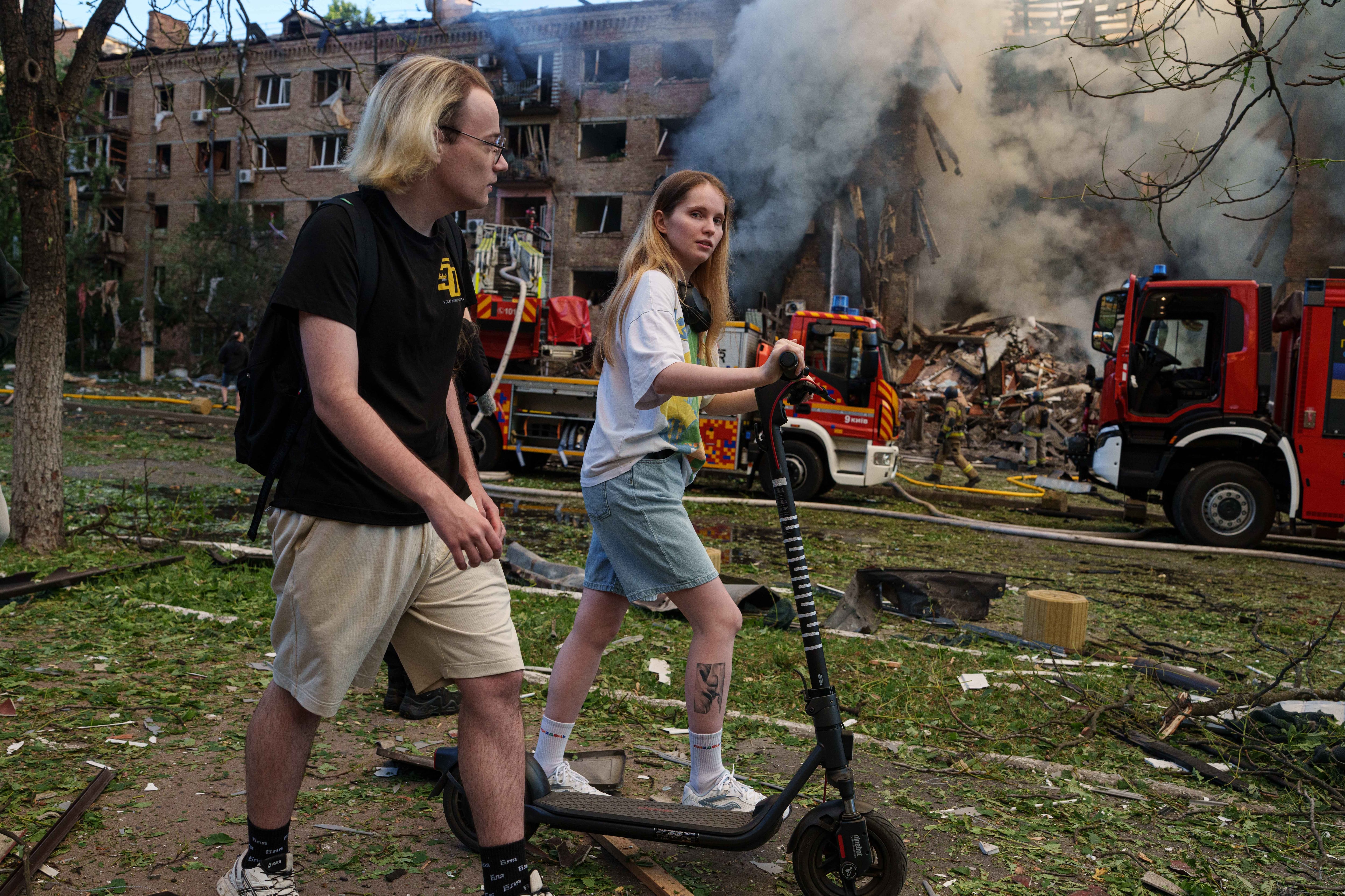 In one of Kyiv's most frequently bombed neighborhoods, residents choose to stay