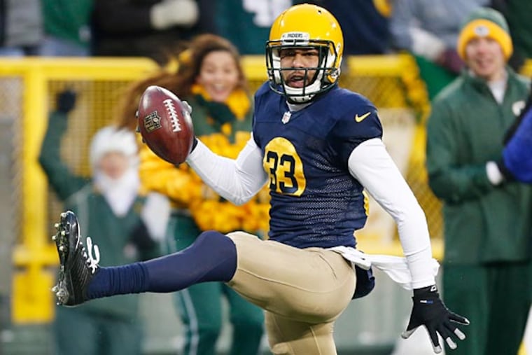 Green Bay Packers' Micah Hyde reacts as he runs back a punt 75 yards
for a touchdown during the first half of an NFL football game against the Philadelphia Eagles Sunday, Nov. 16, 2014, in Green Bay, Wis. (Mike Roemer/AP)