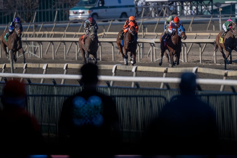 Spectators watch a race at the Parx Racing track in Bensalem, Pa., on March 10, 2021.