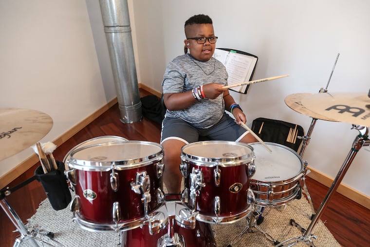 8-year-old Cooper Fenton on the drums during a rehearsal of Shakespeare in Clark Park's "Twelfth Night."