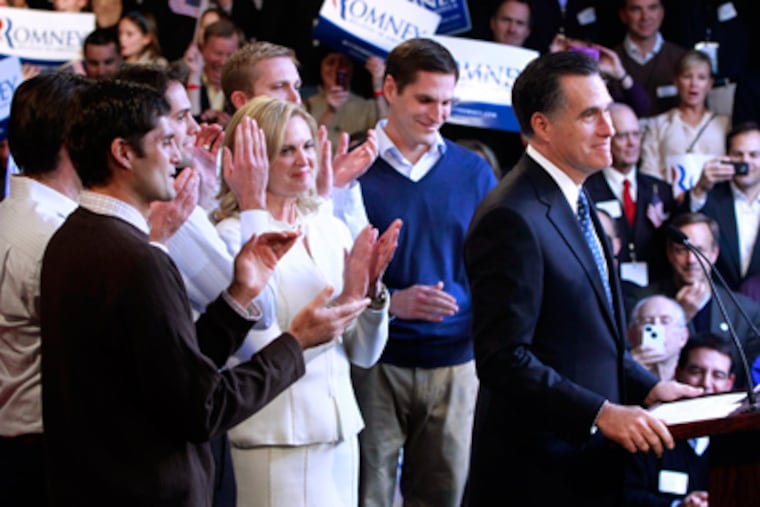 Mitt Romney addresses a primary-night party in Manchester, N.H., with his wife, Ann, and sons behind him. The former Massachusetts governor won New Hampshire’s Republican primary a week after his tight victory in the Iowa caucuses. (Charles Dharapak / Associated Press)