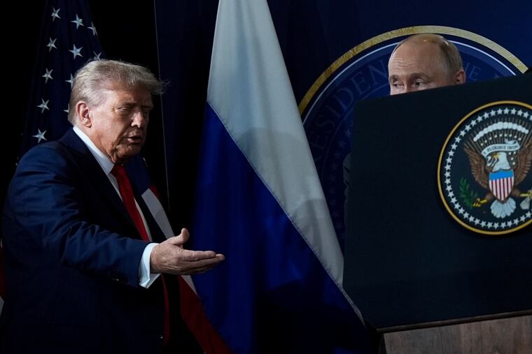 President Donald Trump and Russia's President Vladimir Putin arrive for a news conference at Joint Base Elmendorf-Richardson Friday in Anchorage, Alaska.