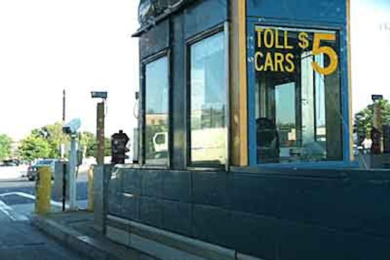 The vew going westbound through the Ben Franklin Bridge toll plaza in Camden. The cost of crossing the bridge went to $5, from $4 today, and many motorists are not happy. (Peter Mucha / Staff)