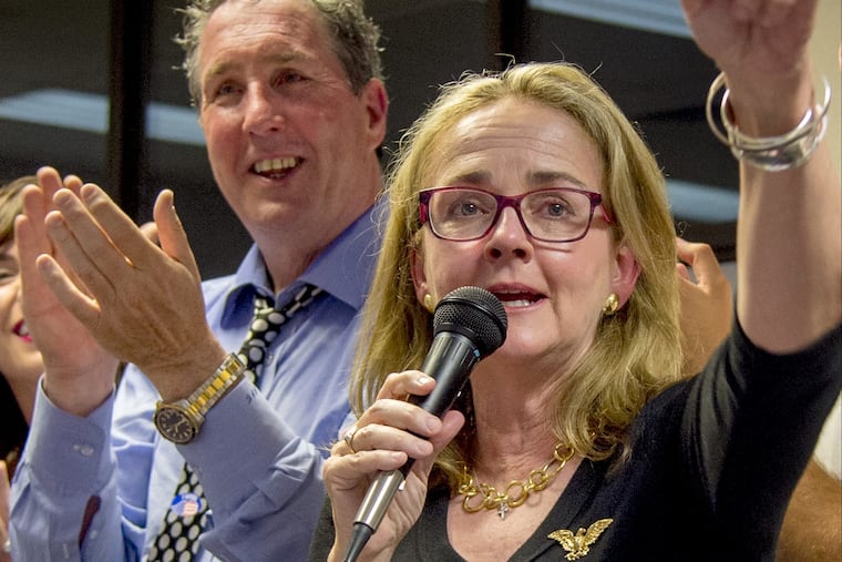 Madeleine Dean thanks her supporters after winning the democratic nomination in the Fourth Congressional District primary in May. Husband Patrick J. Cunnane is at rear.