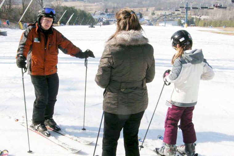 Phil Shutler instructs two of his pupils at Liberty Mountain near Gettysburg. He offers lessons two days a week.