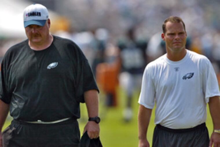 Eagles' coach Andy Reid (left) and general manager Tom Heckert are gearing up for NFL draft.