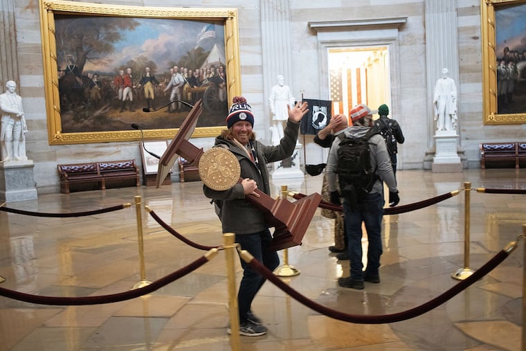 Adam Johnson, of Parrish, Fla., carried House Speaker Nancy Pelosi's lectern through the U.S. Capitol during the Jan. 6, 2021, riot. Now he's running for a county commission seat.