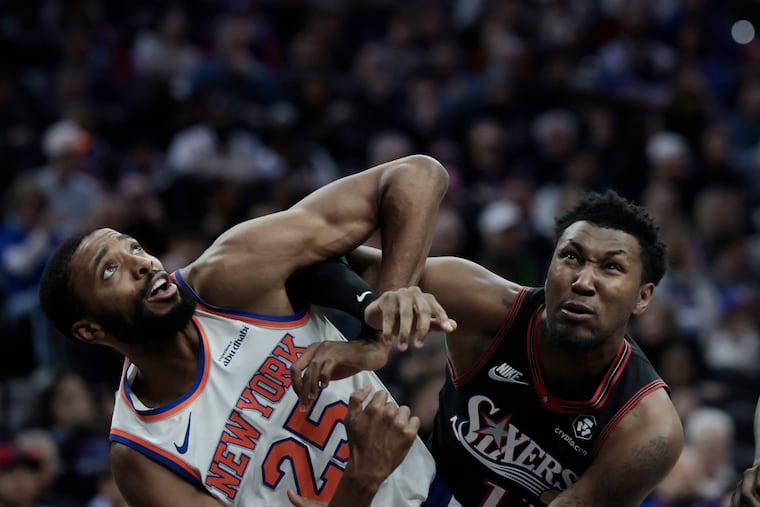 Knicks forward Mikal Bridges (left) scored 22 points to power New York to a blowout win over the Sixers.