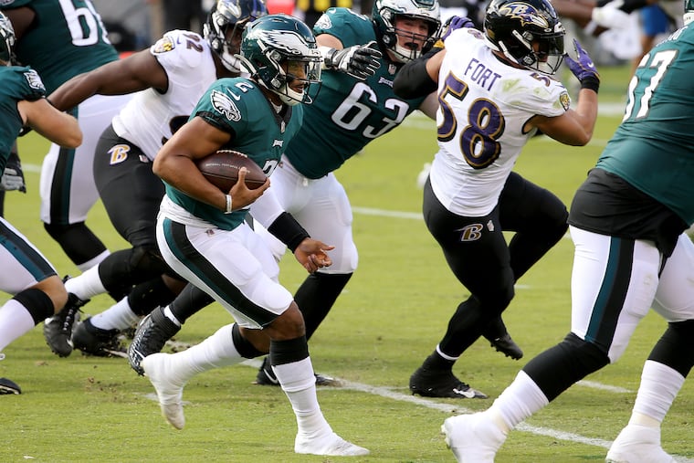 Eagles quarterback Jalen Hurts runs against the Ravens in 2020.