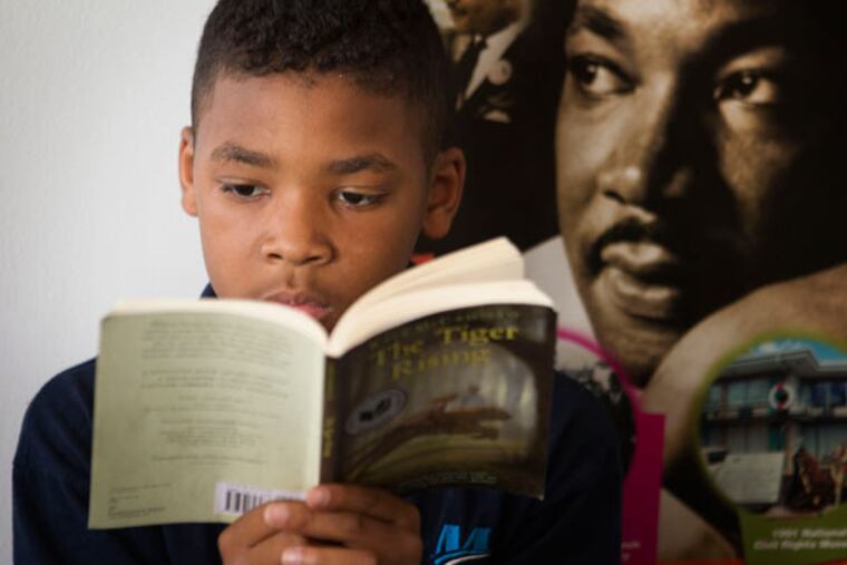 Kasyir Lee, 10, a fourth- grader at Cleveland Mastery Charter School: The school takes part in a
program with the D.A.’s Office to keep kids in school. (LAURENCE KESTERSON/FOR THE DAILY NEWS)