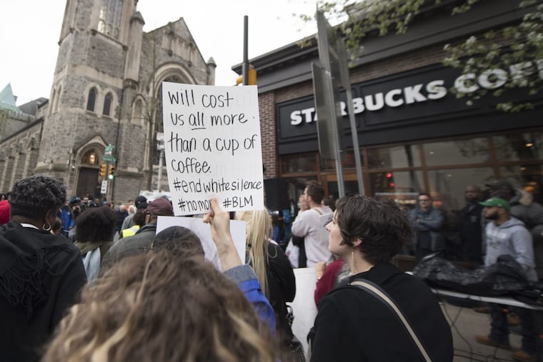 Protesters gathered outside the Starbucks on 18th & Spruce Streets. Two black men were arrested in a video incident that went viral.