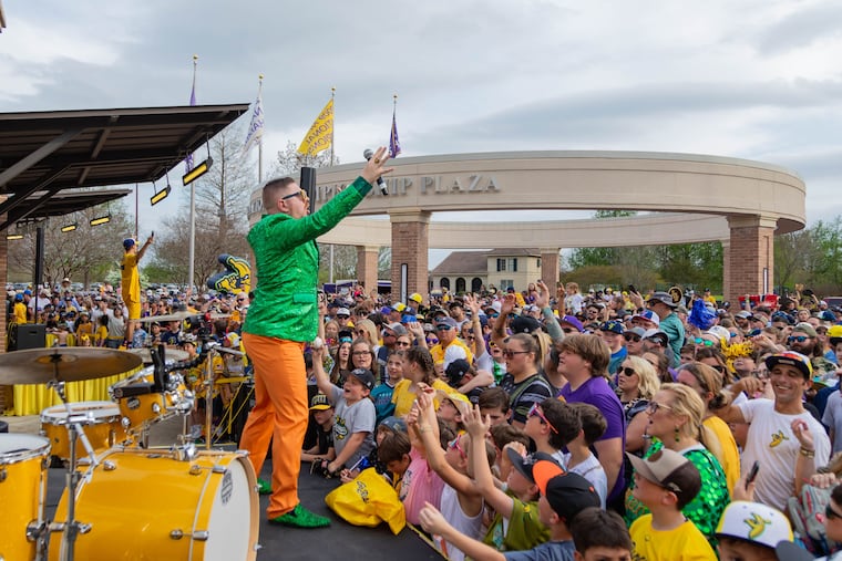Matt Graifer, also known as the Young Professor, hypes up the crowd outside a Savannah Bananas game.