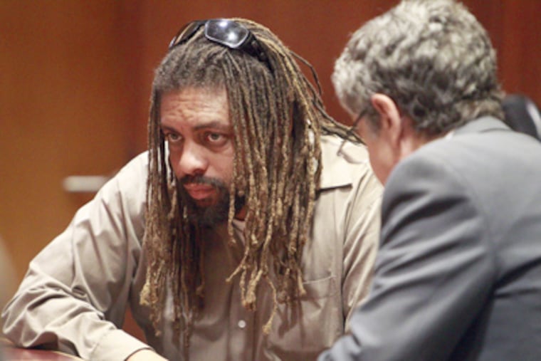 Ed Forchion, aka "New Jersey Weedman," and defense lawyer, Donald Ackerman, consult at the courtroom earlier this month. ( AKIRA SUWA / Staff Photographer )