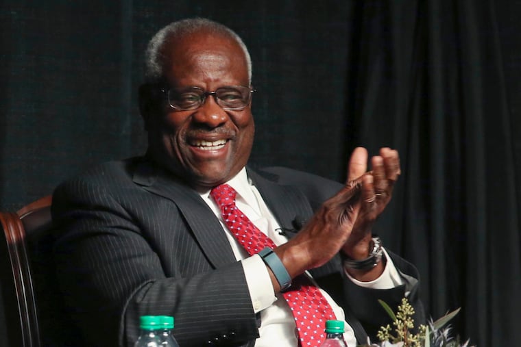 Supreme Court Justice Clarence Thomas laughs before speaking to an audience at McLennan Community College in Waco, Texas, in 2017.