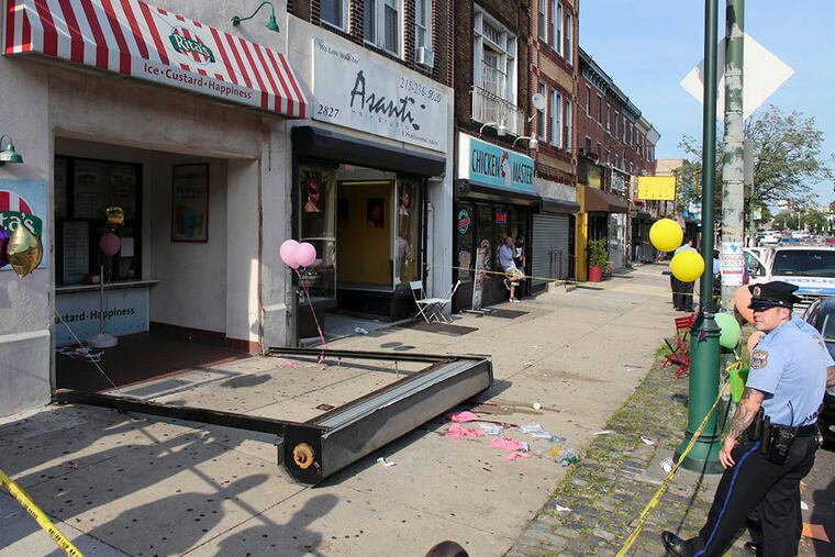 The security gate on this Rita’s Water Ice on Girard Avenue fell on June 28, 2014, killing Wynter Larkin, 3, of Yeadon — five years after it passed an inspection. (JOSEPH KACZMAREK / AP, File)