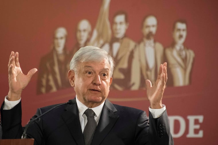 Mexico's President Andres Manuel Lopez Obrador holds his first news conference as president, which started at 7 a.m. local time in Mexico City, Monday, Dec. 3, 2018. Mexico's newly inaugurated president hit the ground running Monday with his pledge to govern as a common man and end decades of secrecy, heavy security and luxury enjoyed by past presidents. (AP Photo/Christian Palma)
