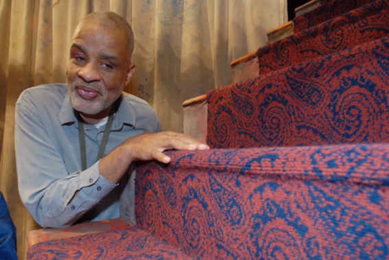 Bill Newman, who is visually impaired, gets a tactile sense of the set for "Humor Abuse."