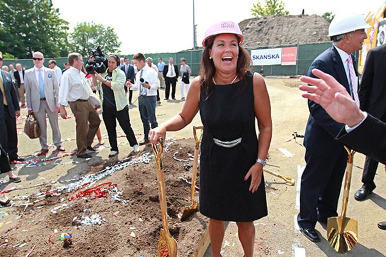 With golden shovel still in hand, SugarHouse Casino general manager, Wendy Hamilton, smiles as she talks to a SugarHouse supporter after the groundbreaking event held in the north parking lot of the current casino property.
