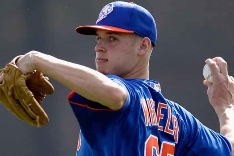 New York Mets pitcher Zack Wheeler throws during the team's first pitchers and catchers workout at spring training baseball, Wednesday, Feb. 13, 2013, in Port St. Lucie, Fla. (Julio Cortez/AP)