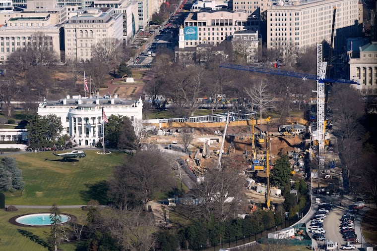 Marine One, with President Donald Trump aboard, lifts off the South Lawn at the White House with the new ballroom construction visible on the right.
