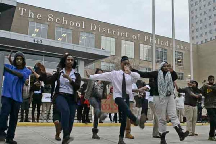Philadelphia public school students perform the Thriller dance to protest Philadelphia School District plan to close 37 schools in front of Philadelphia School District headquarters on Broad St. January 15, 2013. ( RON TARVER / Staff Photographer )