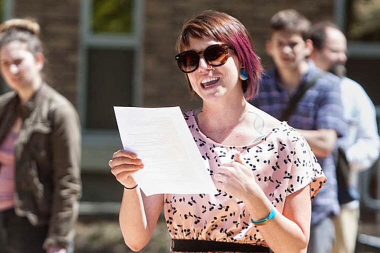 Cynthia Jones, an organizer of a rally at West Chester University to protest sexual assault, reads a speech. About 75 people attended. (Ed Hille/Staff)