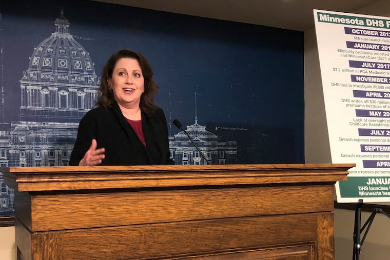 FILE - State Sen. Michelle Benson reacts at a news conference on Wednesday, April 10, 2019 at the Minnesota State Capitol in St. Paul to a report by the state's legislative auditor on combatting fraud in Minnesota's Child Care Assistance Program. (AP Photo/Steve Karnowski,File)