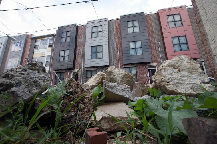 New homes shot from a vacant lot on South Cleveland Street, where developer Ori Feibush said Councilman Johnson blocked his land purchases as political payback.