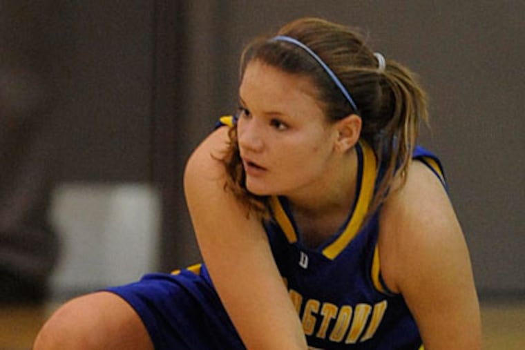 Downingtown East’s Melissa Hummel, right, watches as Downingtown West's Brittany Sicinski looks to make a pass in a game on Jan. 19. Downingtown East plays Cheltenham tonight in the District 1 Class AAAA semifinals. ( Clem Murray / Staff Photographer )