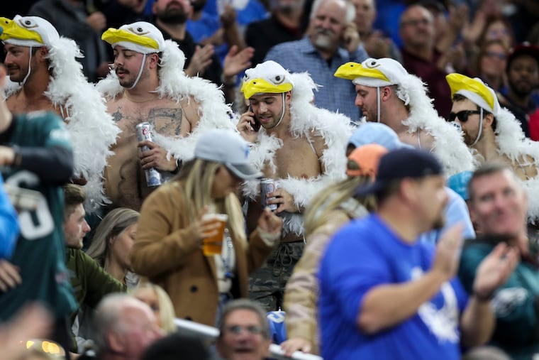 Fans without masks move through the stands during the Eagles game vs. the Detroit Lions at Ford Field in Detroit on Sunday.