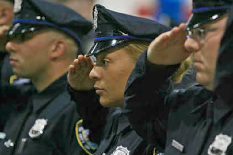 Cadets salute during a ceremony at Rutgers University-Camden. (File Photo)