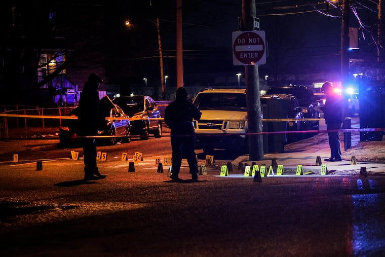 Police on the scene in Mayfair at Rowland and Guilford streets after four people were shot, three fatally, on Jan. 9, 2023.