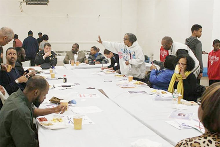 Councilman Kenyatta Johnson, members of the Police Department, community leaders and representatives from the District Attorney’s Office meet with community members in Kingsessing for a call to action meeting for Johnson’s Southwest Philly Youth Gun Violence Task Force.