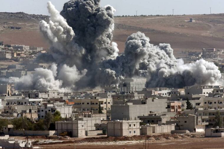 File: In this Oct. 22, 2014, file photo, thick smoke from an airstrike by the US-led coalition rises in Kobani, Syria, as seen from a hilltop on the outskirts of Suruc, at the Turkey-Syria border. The Islamic State group may be sprouting tentacles across the region but it is struggling in Syria, part of its heartland, where it has stalled or even lost ground in fighting with multiple enemies on multiple fronts. There are signs of tensions and powers struggles emerging among its ranks of foreign jihadis. (AP Photo/Lefteris Pitarakis, File)