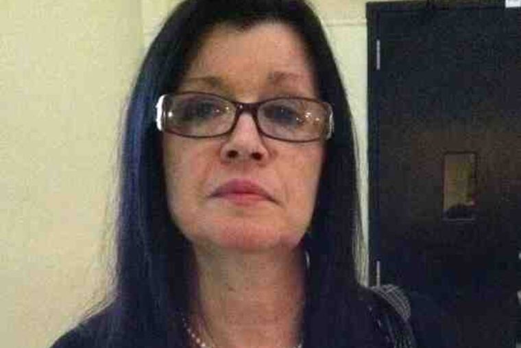 Diane Nevins holds a photo of son Bryan. "I don't know how I will face all the rest of my days without him," she said.