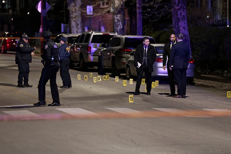 Police gather evidence at the crime scene in the 7100 block of north 19th Street in Philadelphia on Tuesday, April 7, 2026. Around 8:45 pm a 13 year old was shot and killed and a 14 year old was critically injured at that scene.