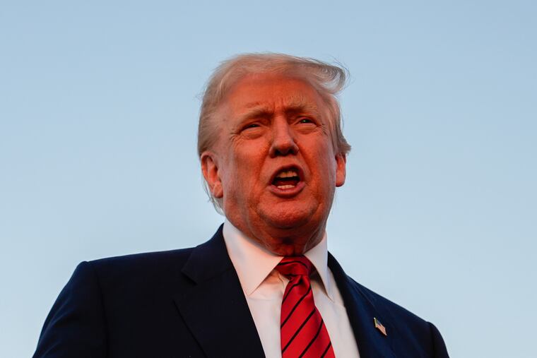 President Donald Trump speaks with reporters before boarding Air Force One at Lehigh Valley International Airport on Sunday.