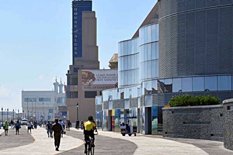 Looking at Atlantic City Boardwalk from New Jersey Avenue at Revel Hotel Casino, toward the now closed Showboat Hotel Casino on September 1, 2014, not many crowds on the boardwalk this Labor Day.