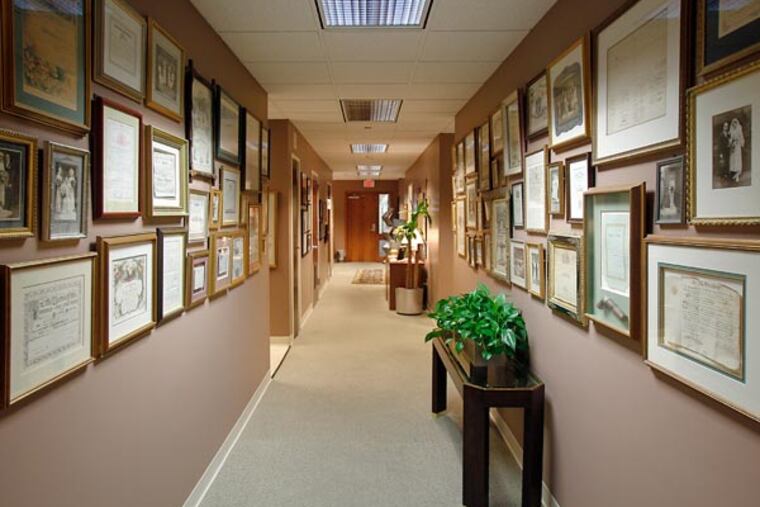 Some 300 antique marriage certificates, wedding photos and artifacts from around the U.S. dating to the 1700s are displayed at the office of Weber Gallagher in Norristown, PA on Aug.30, 2013.( AKIRA SUWA / Staff Photographer )