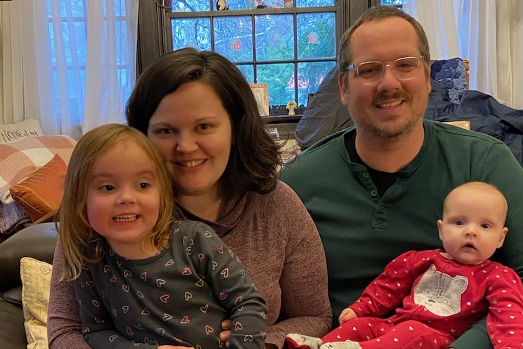 Meagan and Nate with daughters Evelyn (left) and Ruth.